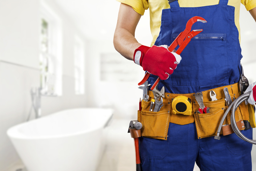 On The Ball Plumbing technician holding plumbing repair equipment in Twin Falls, ID