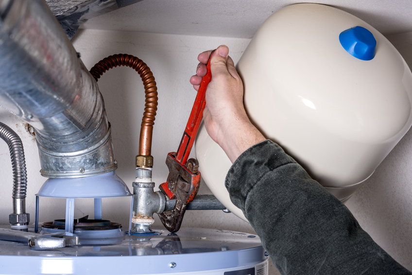 On The Ball Plumbing plumber performing water heater repair in Twin Falls, ID