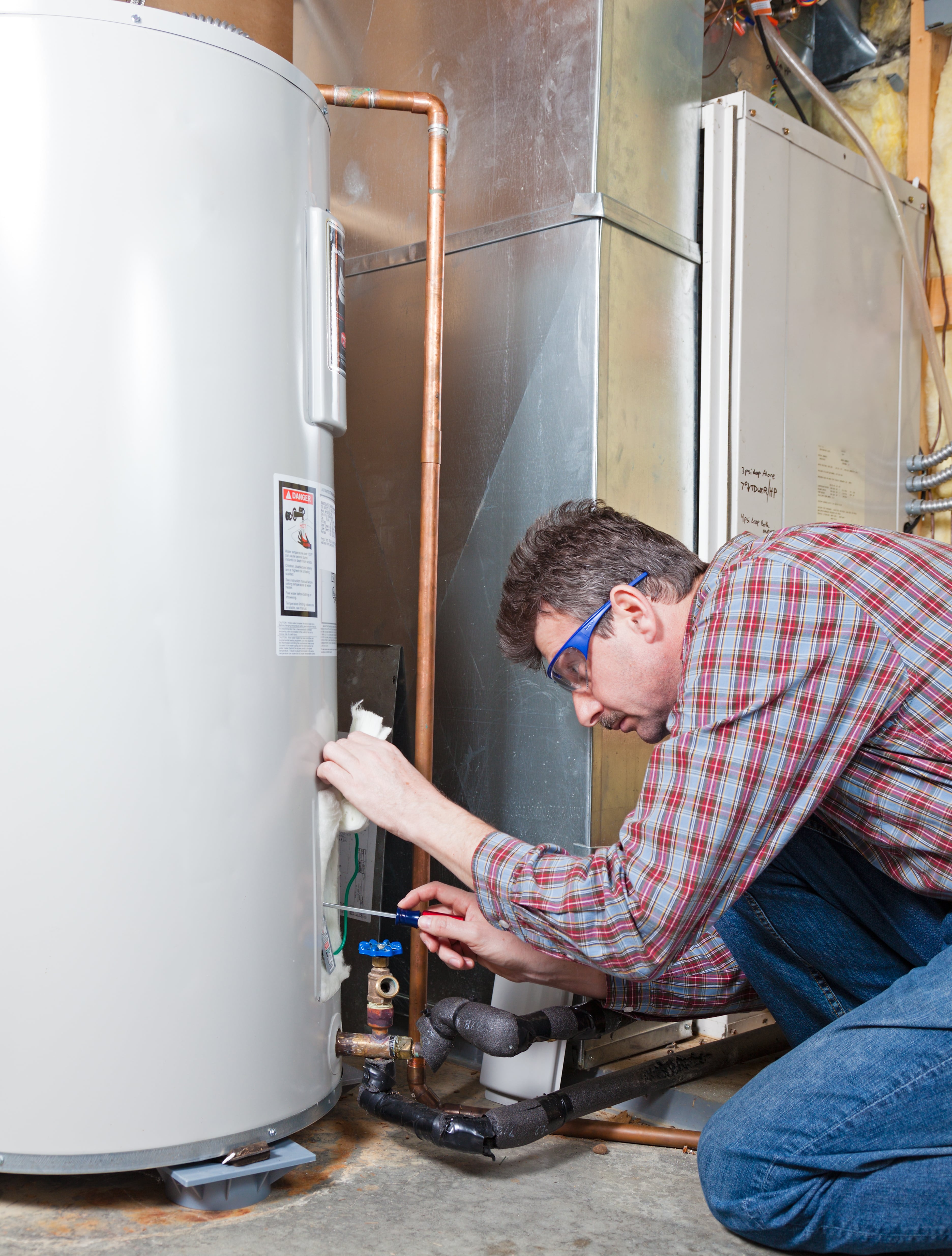 On The Ball Plumbing technician performing water heater installation in Twin Falls, ID